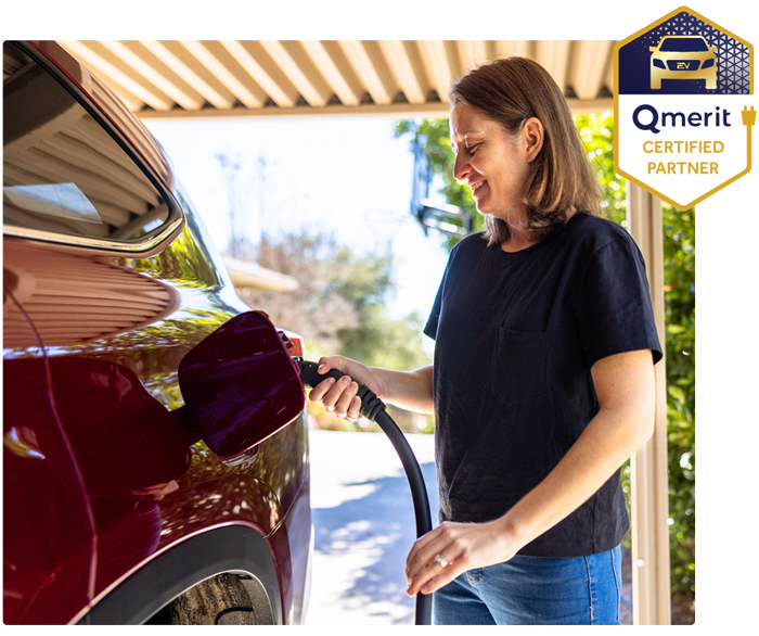 a person standing in front of a car